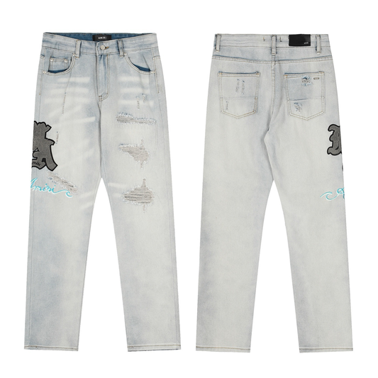 AMIRI WHITE RIPPED JEANS